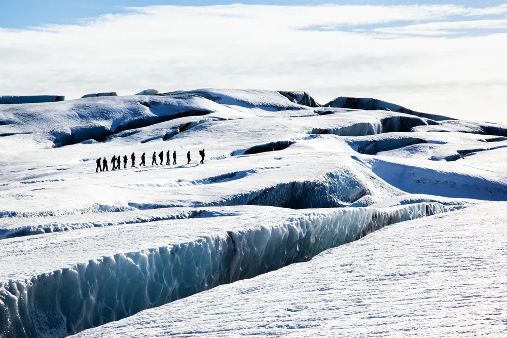 A guided party roped up on a glacier walk in Iceland